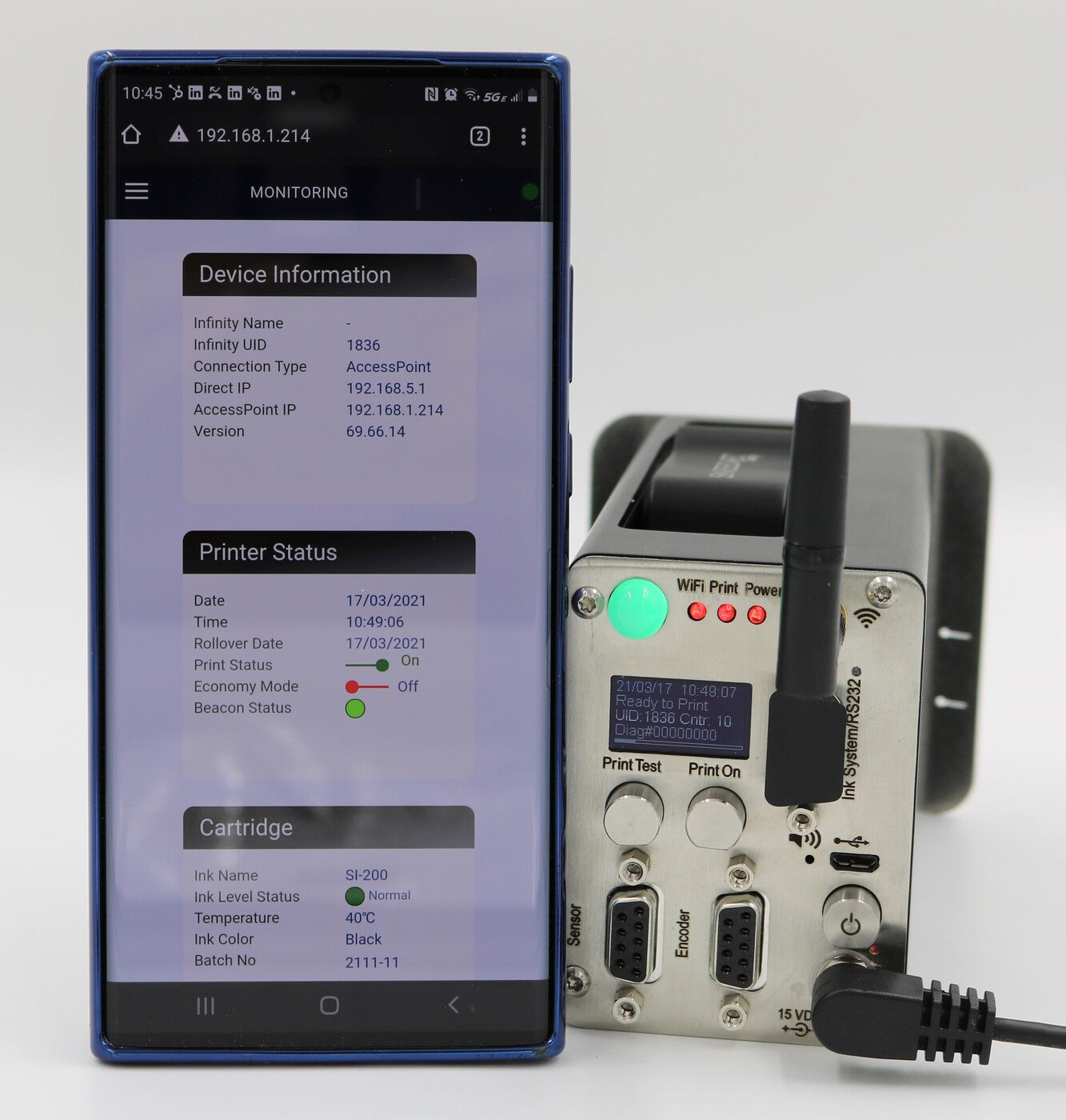 SNEEDJET Infinity printer beside a smartphone displaying the printer monitoring interface