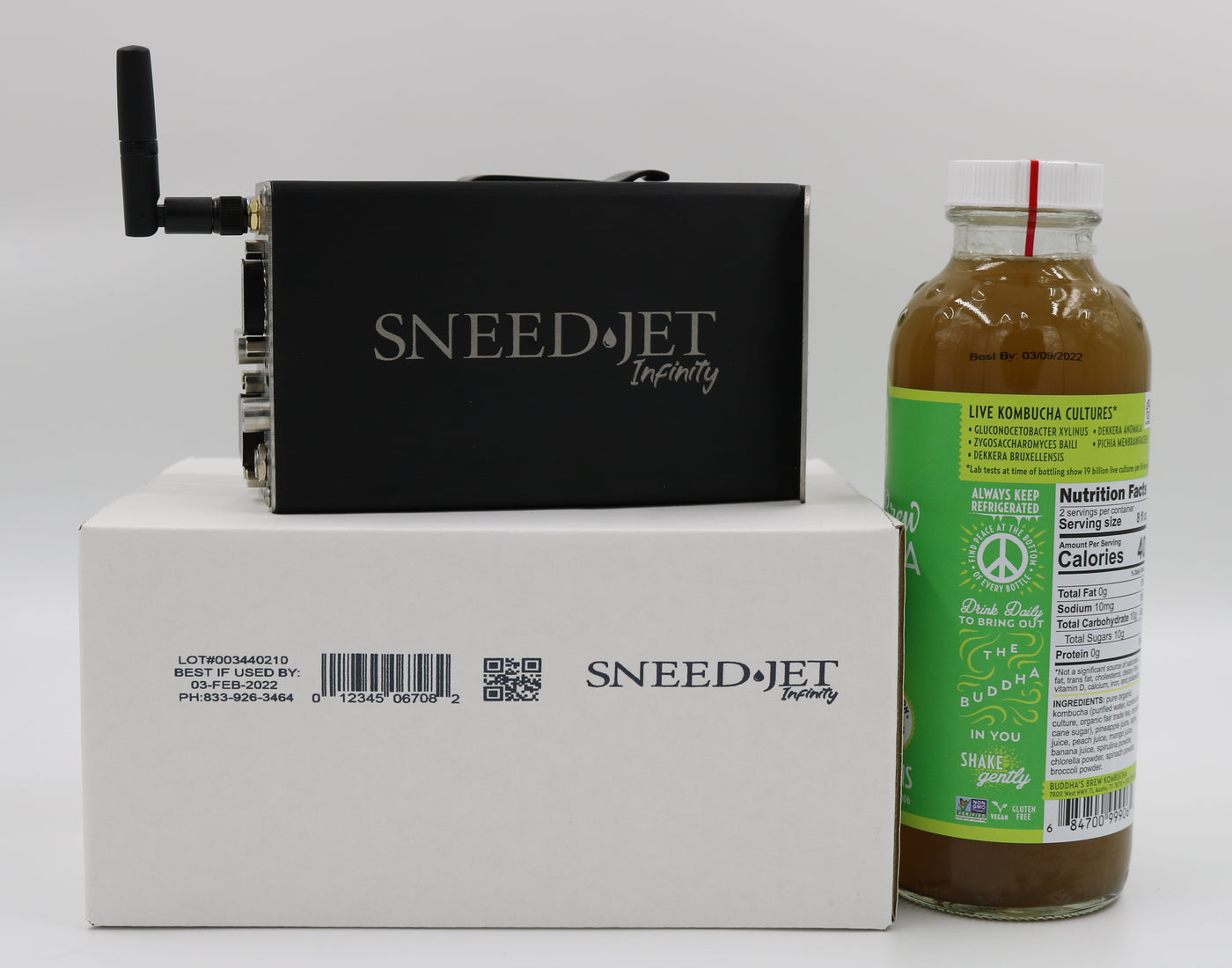 SNEEDJET Infinity printer positioned in front of a bottled kombucha product for coding application example