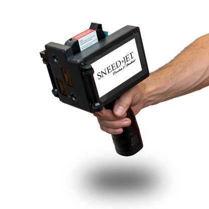 Operator holding the SNEED-JET® Freedom 21 Handheld Printer with its touchscreen visible.