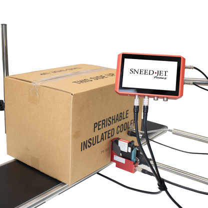 Side view of SNEEDJET Freedom 22 system printing on a corrugated cardboard box labeled “Perishable Insulated Cooler”