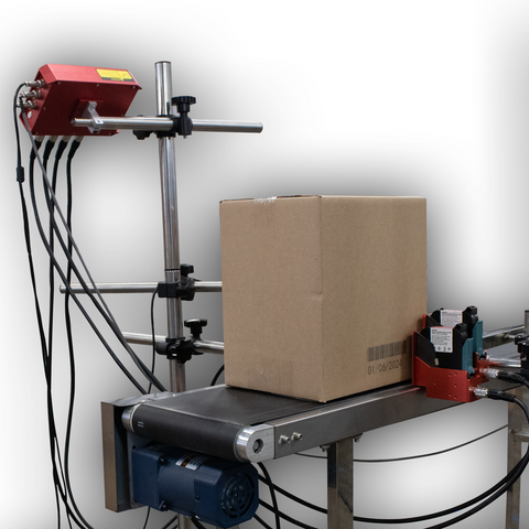 SNEED-JET Freedom 42 thermal inkjet coding system printing a date code on a corrugated box on a conveyor line in a production setup