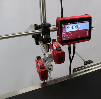 Angled view of SNEED-JET Titan thermal inkjet printer showing touchscreen controller and dual print heads on an adjustable stand