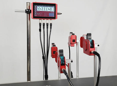 SNEED-JET Titan 44 thermal inkjet printer system with touchscreen controller and four print heads mounted on adjustable stands above a conveyor